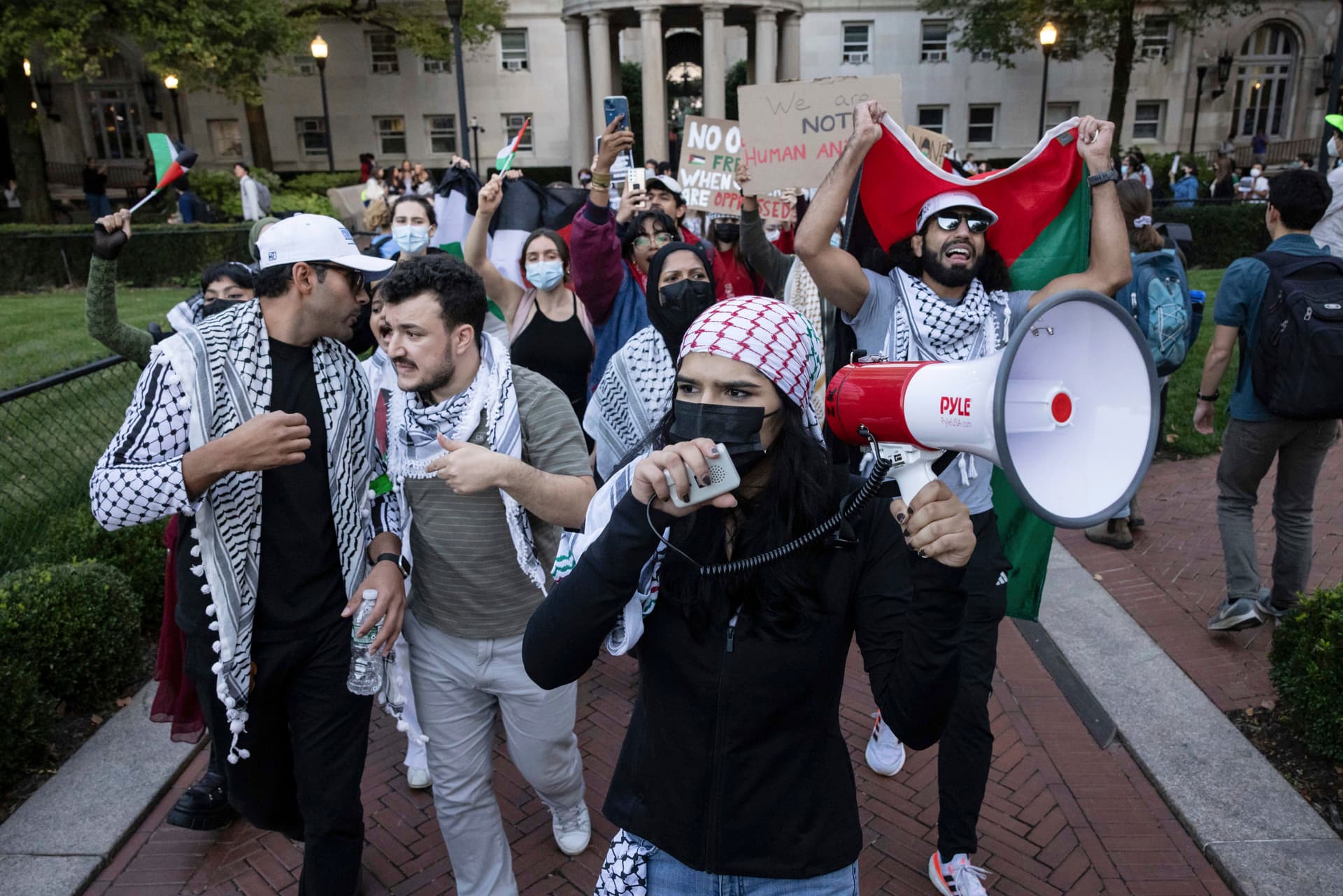 AP/Yuki Iwamura Mahmoud Khalil, second from left, demonstrates during a protest at Columbia University in 2023.
