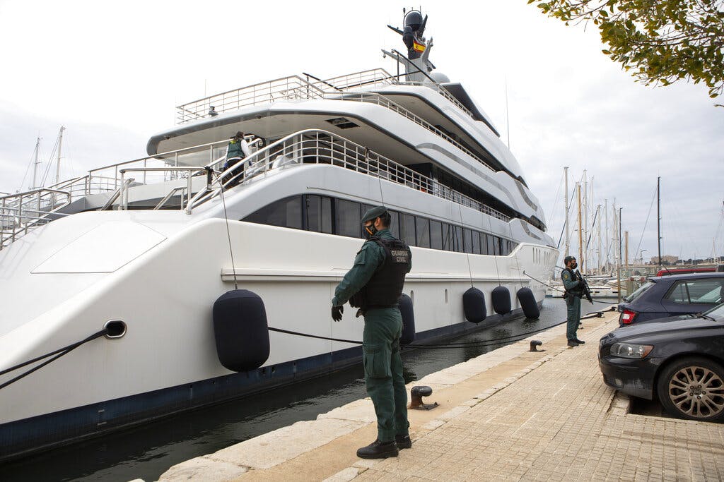 Civil Guards stand by the yacht called Tango at Palma de Mallorca, Spain, on Monday. The yacht is owned by a Russian oligarch. AP Photo/Francisco Ubilla, file