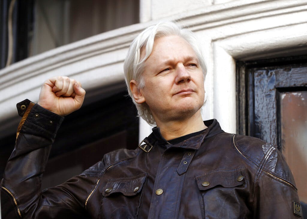 FILE - Julian Assange greets supporters outside the Ecuadorian embassy in London, Friday May 19, 2017. The British government on Friday, June 17, 2022 ordered the extradition of WikiLeaks founder Julian Assange to the United States to face spying charges. He is likely to appeal. (AP Photo/Frank Augstein, File)