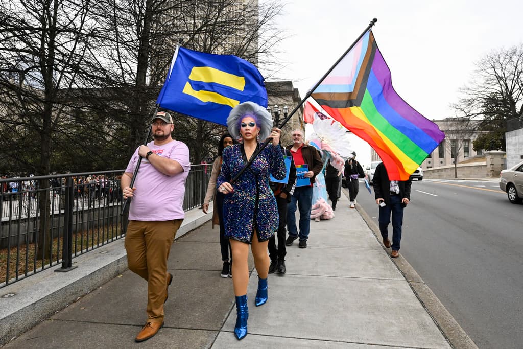 Transgender rights activists march past the state capitol in Tennessee. 