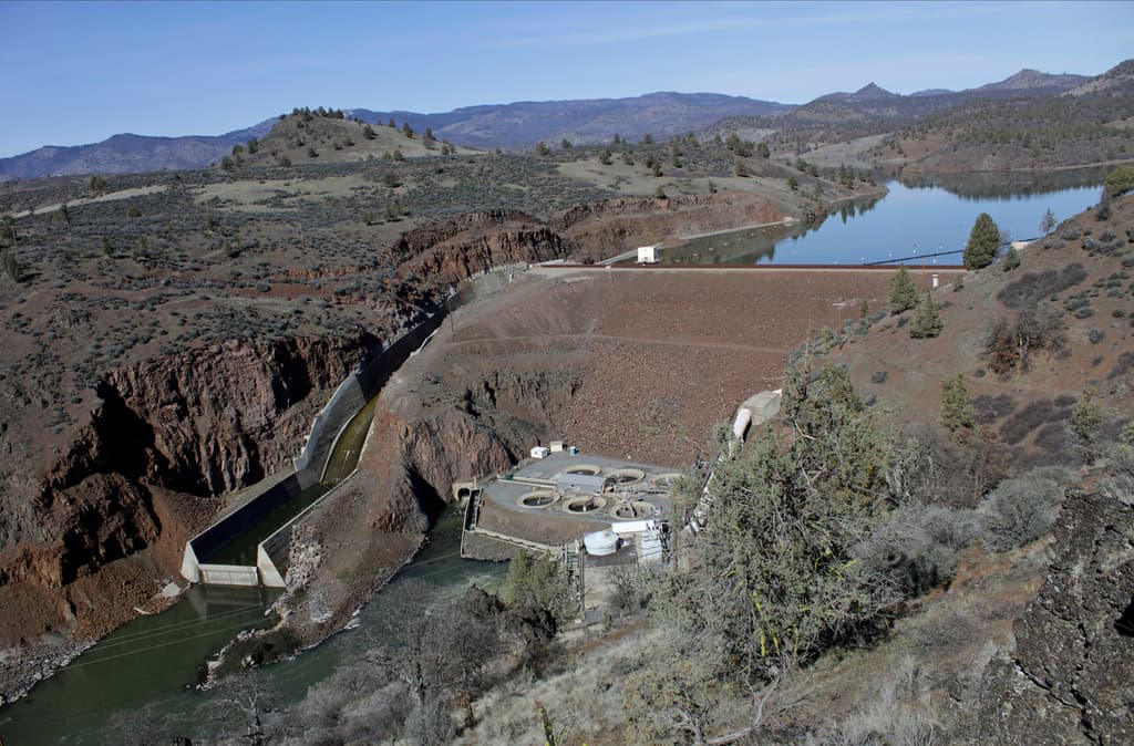 The Iron Gate Dam powerhouse and spillway are seen on the lower Klamath River near Hornbrook, California, in 2020. 