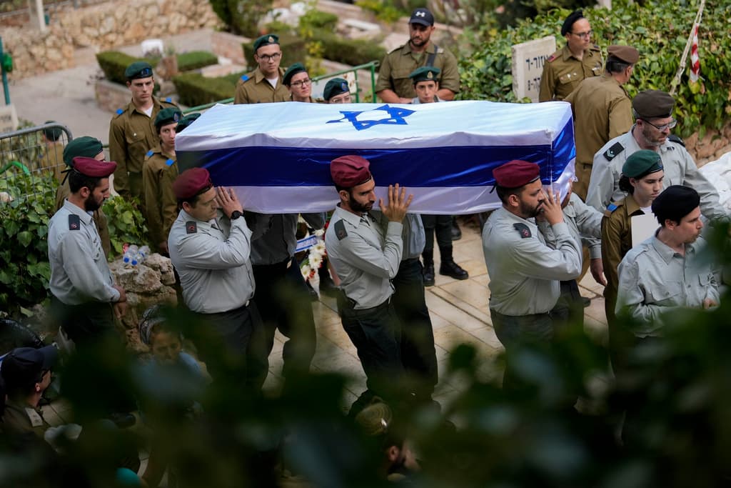 Israeli soldiers carry the flag-covered coffin of Major Tal Cohen during his funeral at the Givat Shaul cemetery at Jerusalem, October 10, 2023. 