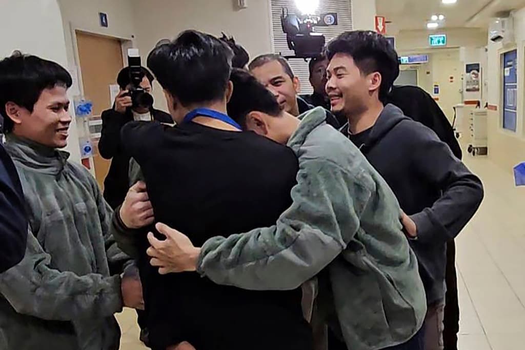 Thai hostages, who were previously released, embrace their newly-freed compatriots at the Shamir Medical Center in Israel, November 28, 2023. 