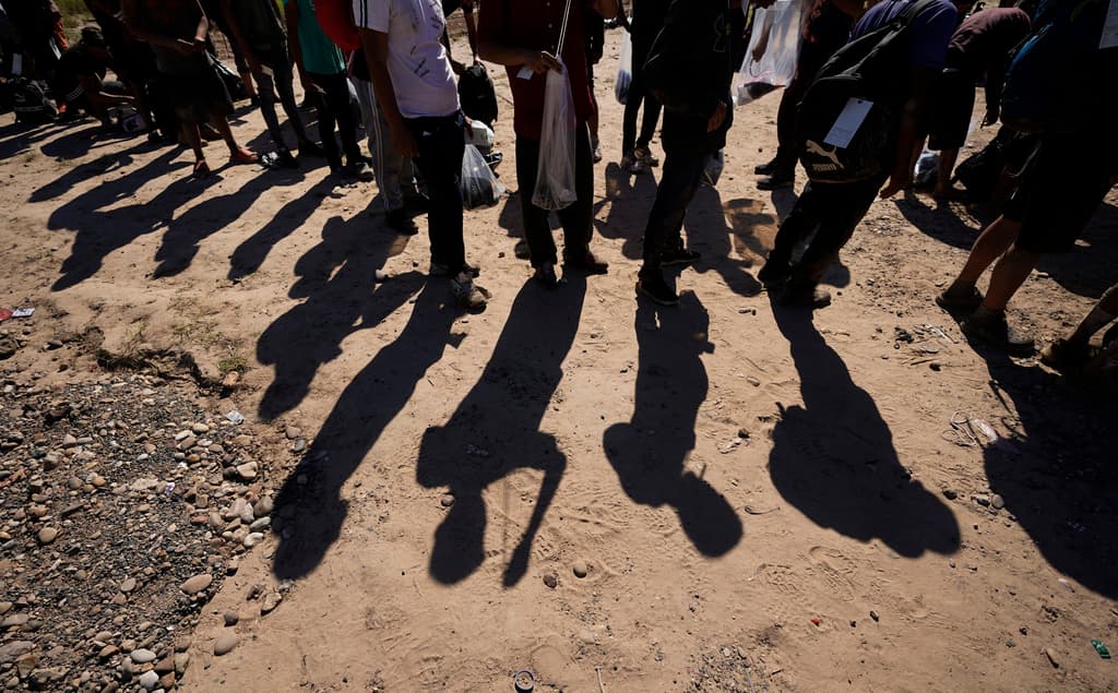 Migrants wait to be processed by Customs and Border Protection after they crossed the Rio Grande from Mexico.