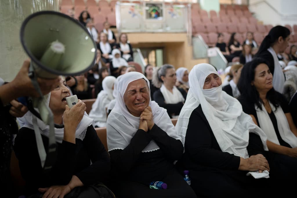 Members of the Druze minority attend a memorial ceremony July 29, 2024, for the children and teenagers killed in a rocket strike at a soccer field over the weekend at the village of Majdal Shams, Golan Heights.