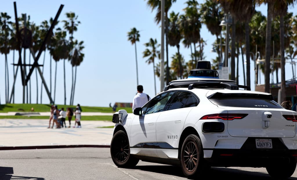 A Waymo self-driving vehicle drives along Venice Beach on March 14, 2024, at Los Angeles.
