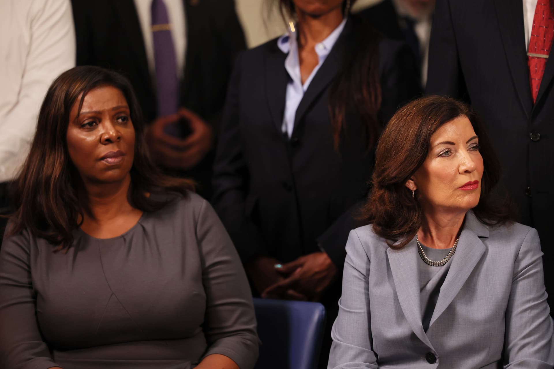 Attorney General Letitia James and Governor Kathy Hochul listen in 2024 as Mayor Eric Adams speaks during a press conference on gun violence prevention and public safety. 