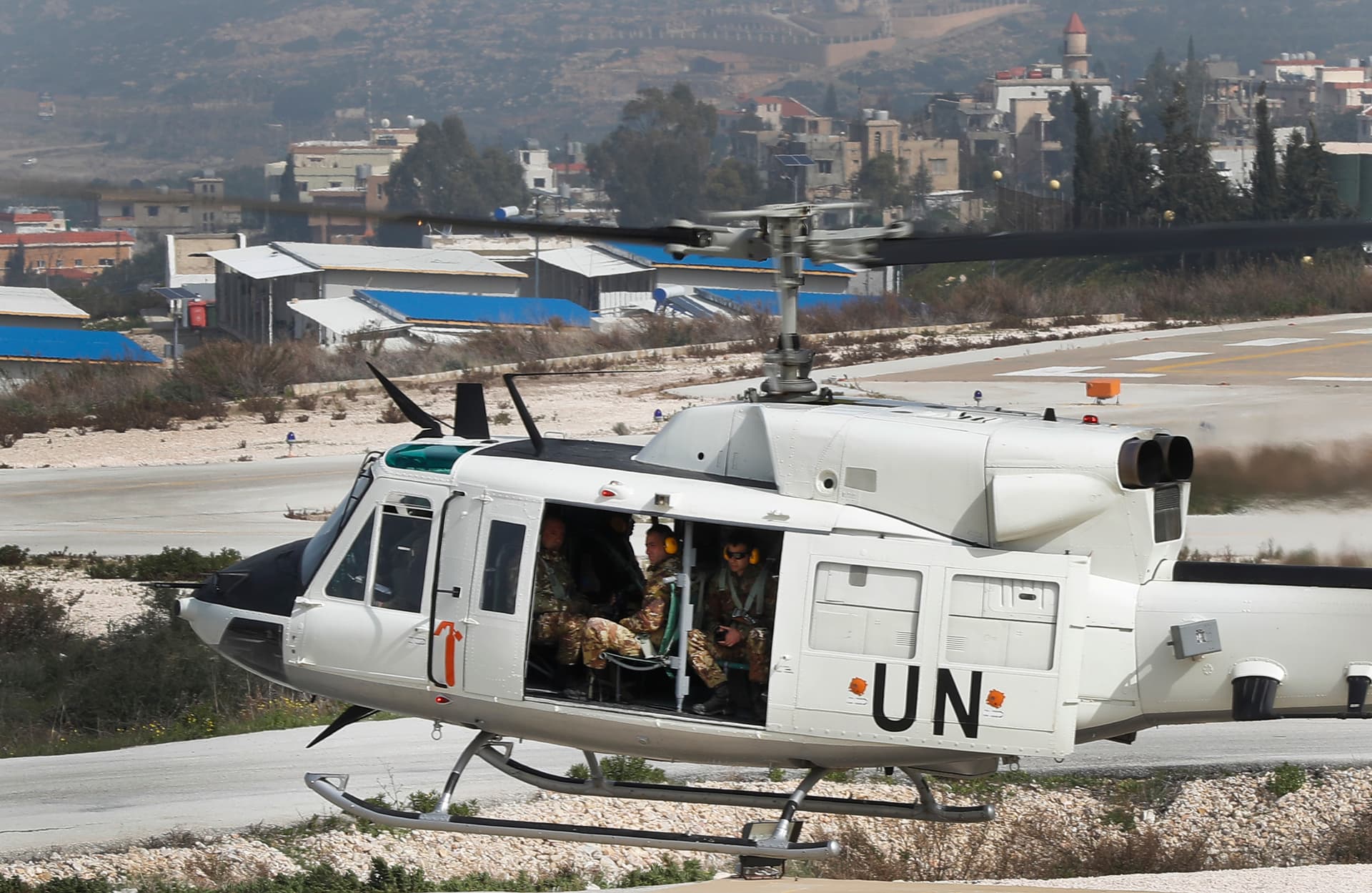 FILE - A United Nations helicopter carrying Italian peacekeepers takes off from the UNIFIL headquarters for a patrol over the Blue Line, a U.N.-drawn boundary between Lebanon and Israel, in the costal town of Naqoura, southern Lebanon, Wednesday, Feb. 7, 2018. 
