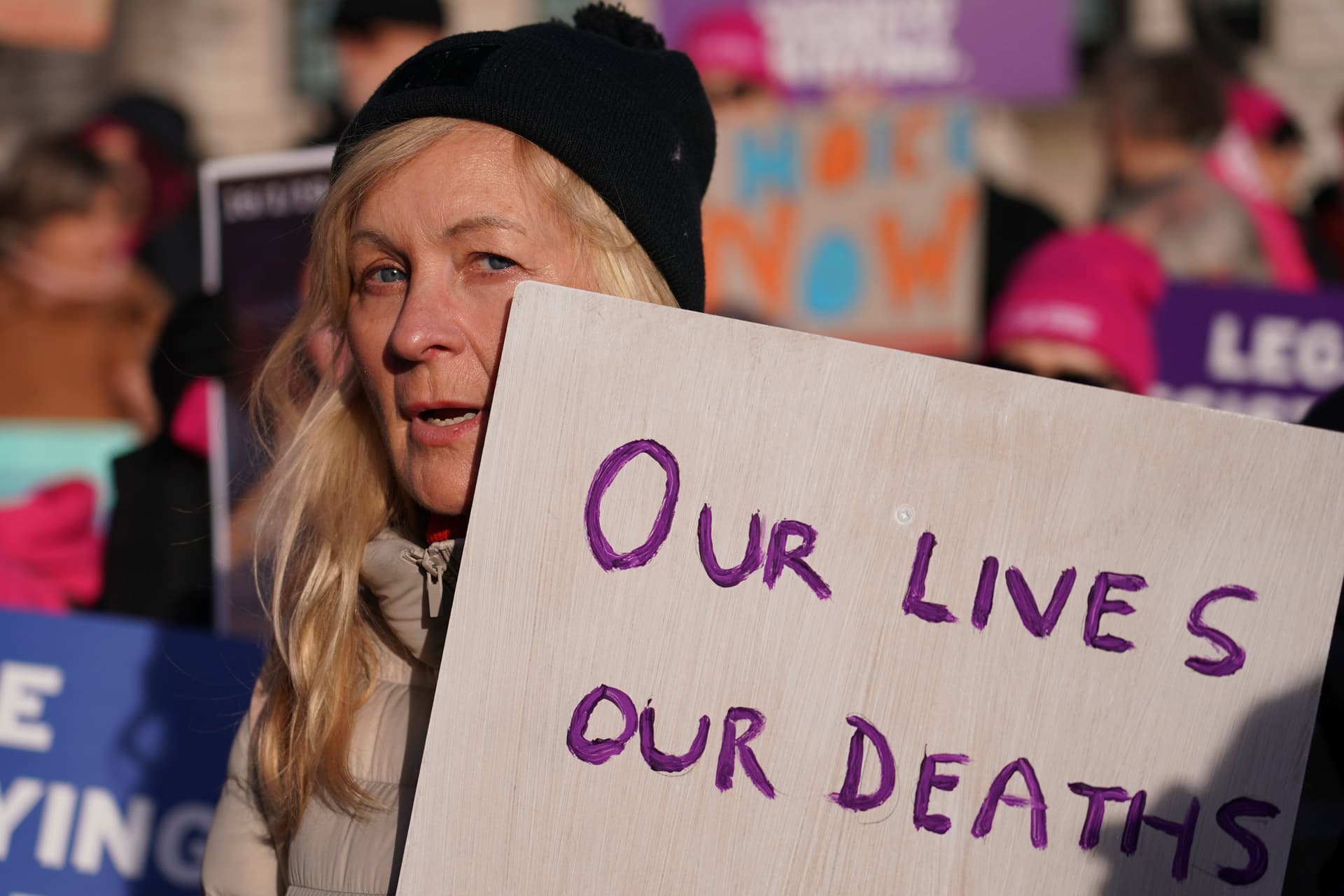 Pro-legal assisted suicide supporters demonstrate.
