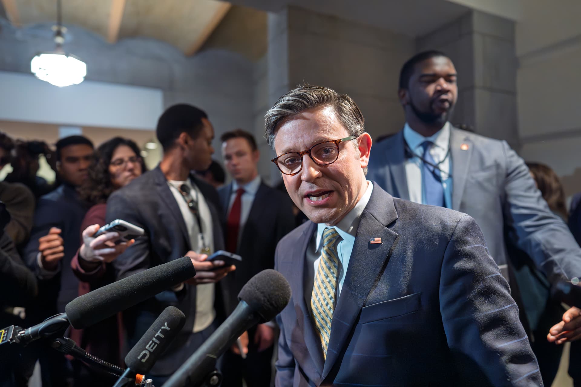 Speaker Johnson emerges from a closed-door meeting with fellow Republicans at the Capitol, December 20, 2024. 