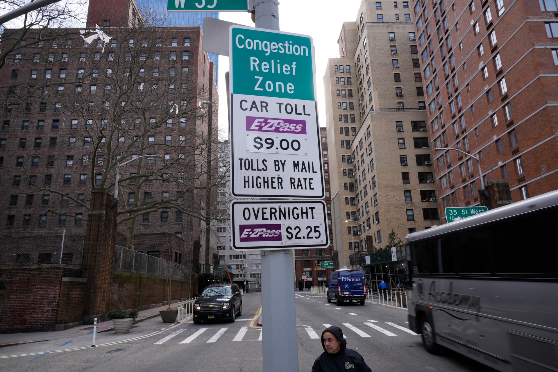 Signs advising drivers of congestion pricing tolls near the Lincoln Tunnel at New York, February 19, 2025