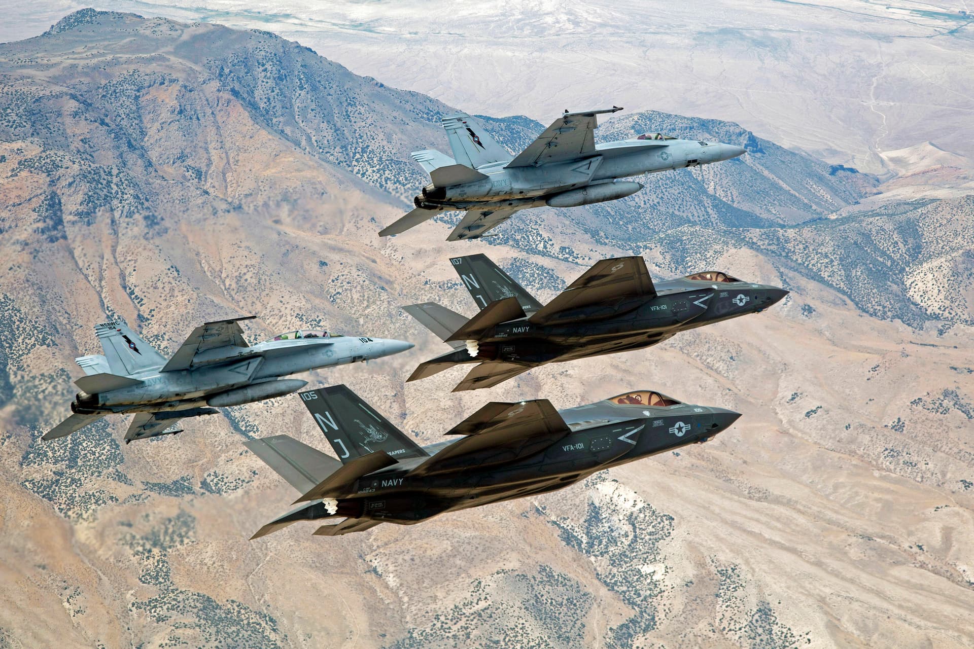 F-35C Lightning IIs and F/A-18E/F Super Hornets fly over Naval Air Station Fallon's Range Training Complex near Fallon, Nevada. 