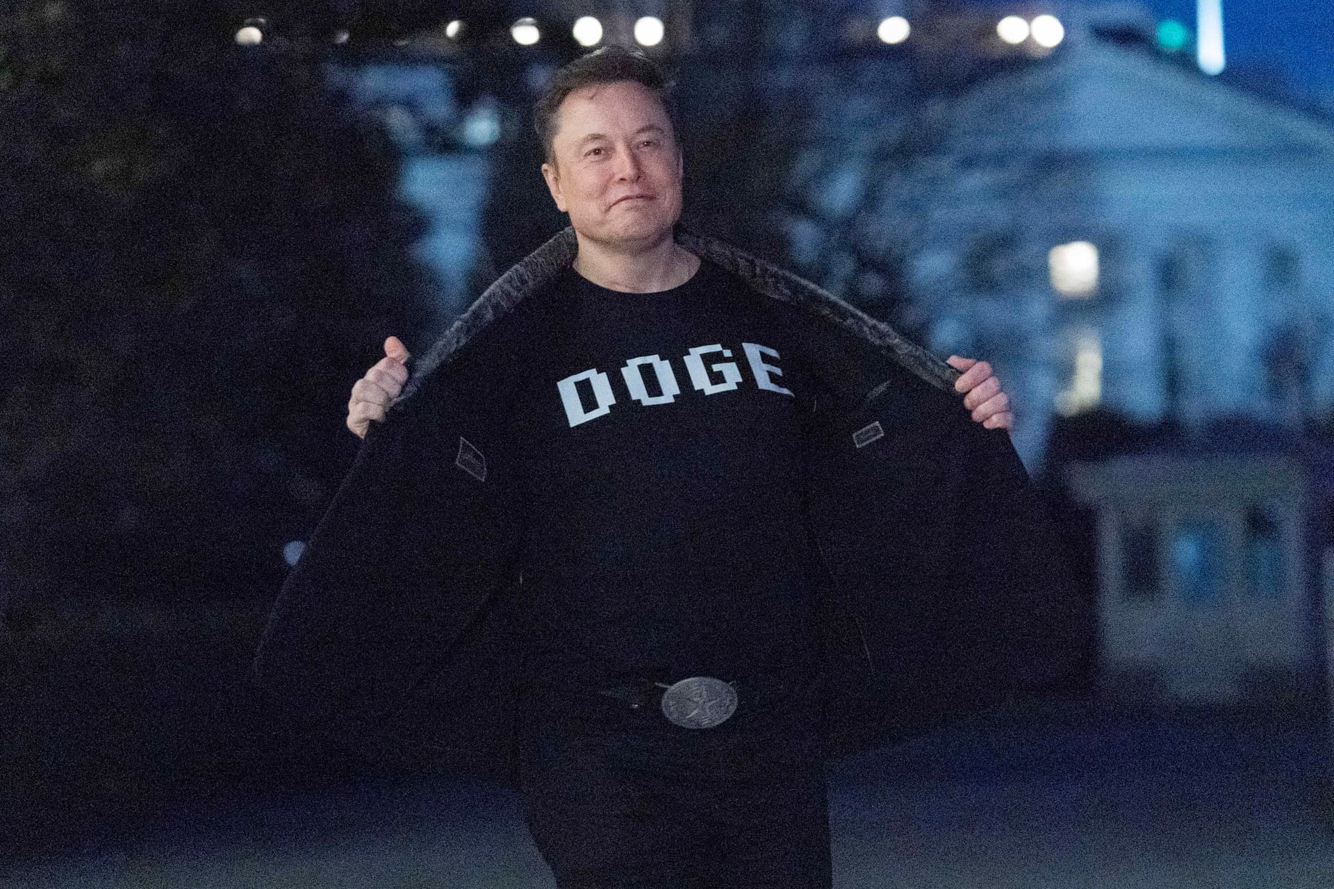 Elon Musk sports a T-shirt that reads 'DOGE' on the South Lawn of the White House, March 9, 2025. 