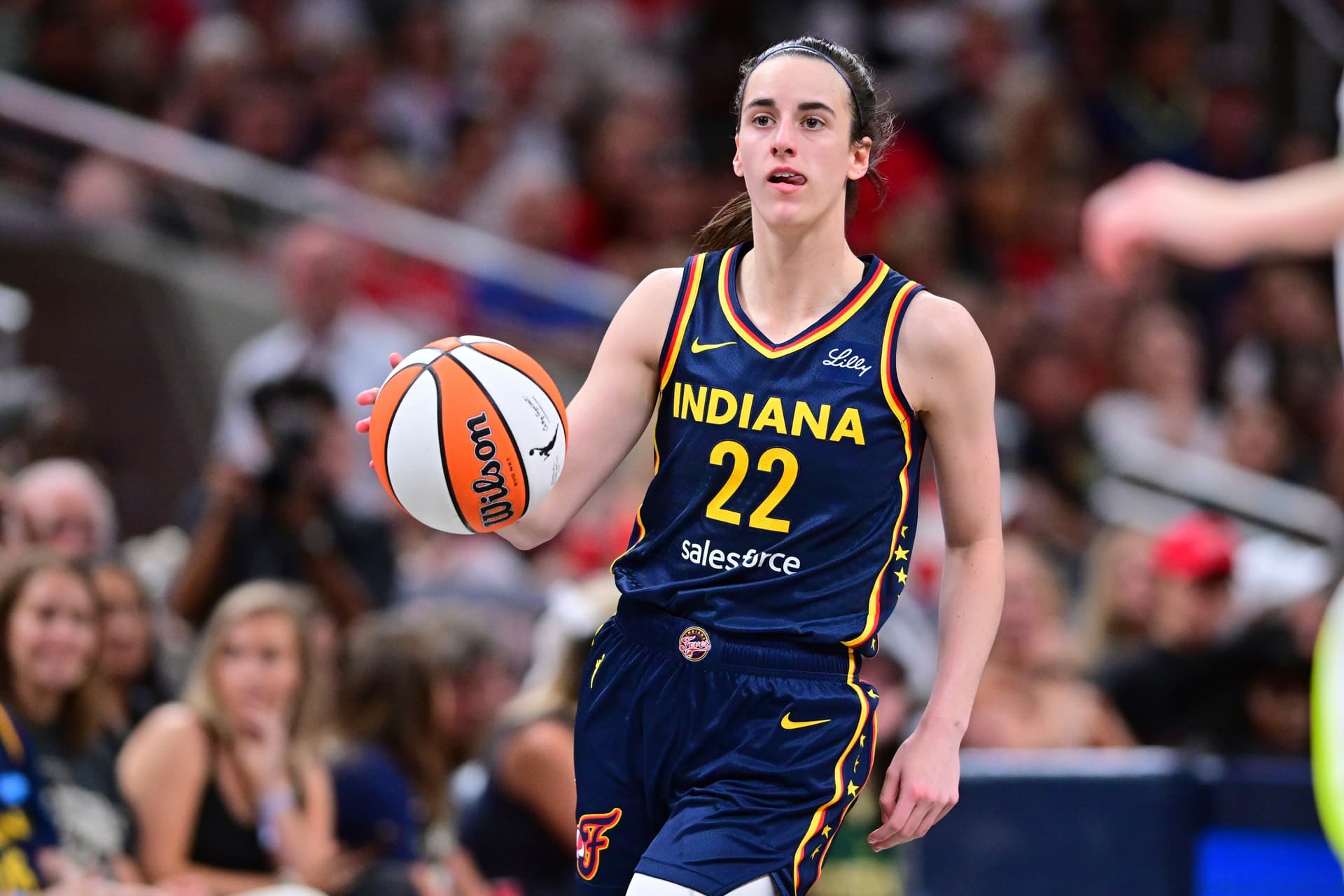 Indiana Fever's Caitlin Clark dribbles during the second half of a WNBA basketball game against the Dallas Wings on Sunday, July 13, 2025, in Indianapolis. 