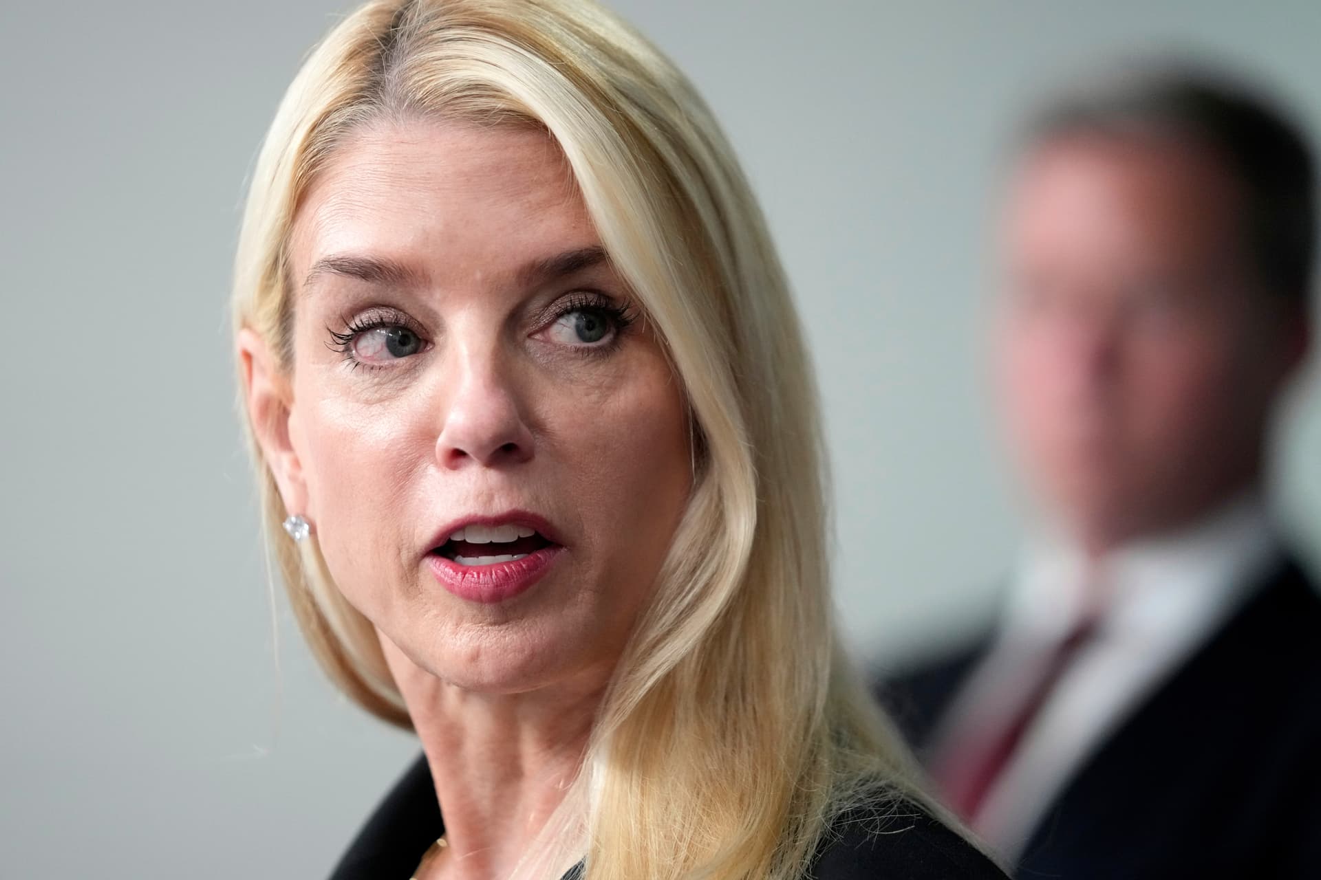 Attorney General Pam Bondi speaks with reporters during a briefing with President Donald Trump at the White House, August 11, 2025.