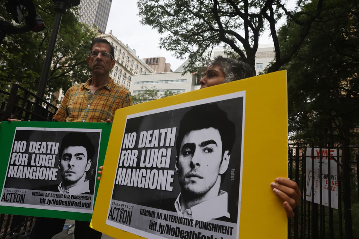 Supporters of Luigi Mangione gather following a hearing where terrorism charges against him were dismissed in the murder of UnitedHealth Care CEO Brian Thompson, outside of Manhattan Supreme Court on September 16, 2025.