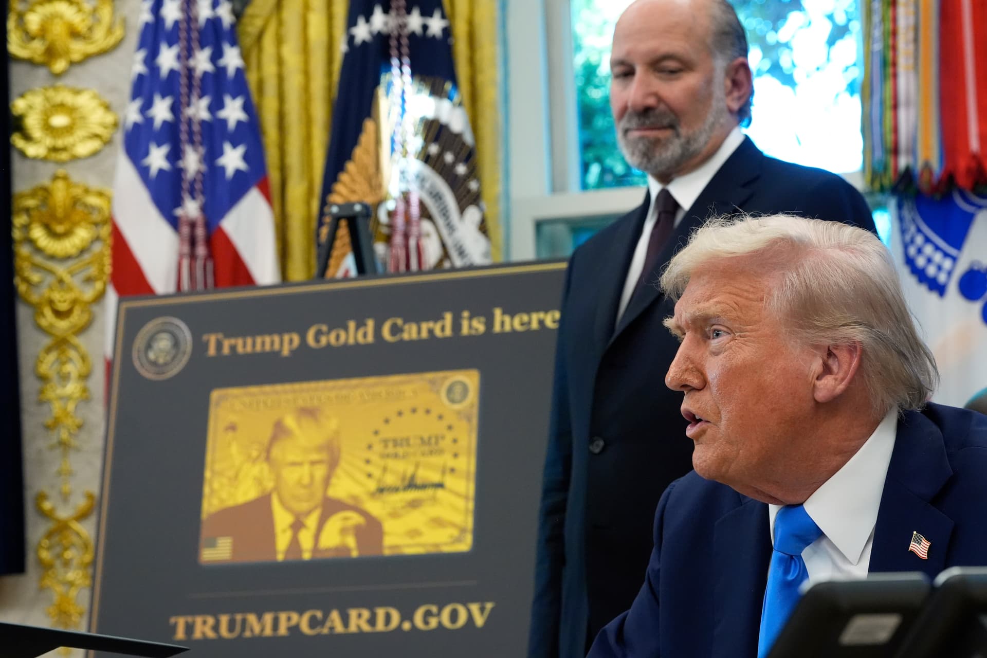 Commerce Secretary Howard Lutnick looks on as President Trump announces new visa policies in the Oval Office on September 19, 2025. 