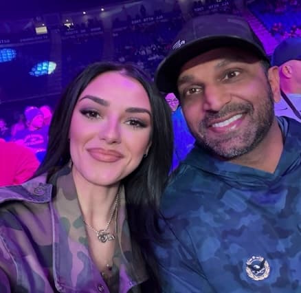 Kash Patel and his girlfriend Alexis Wilkins at a wrestling match where she performed the National Anthem.