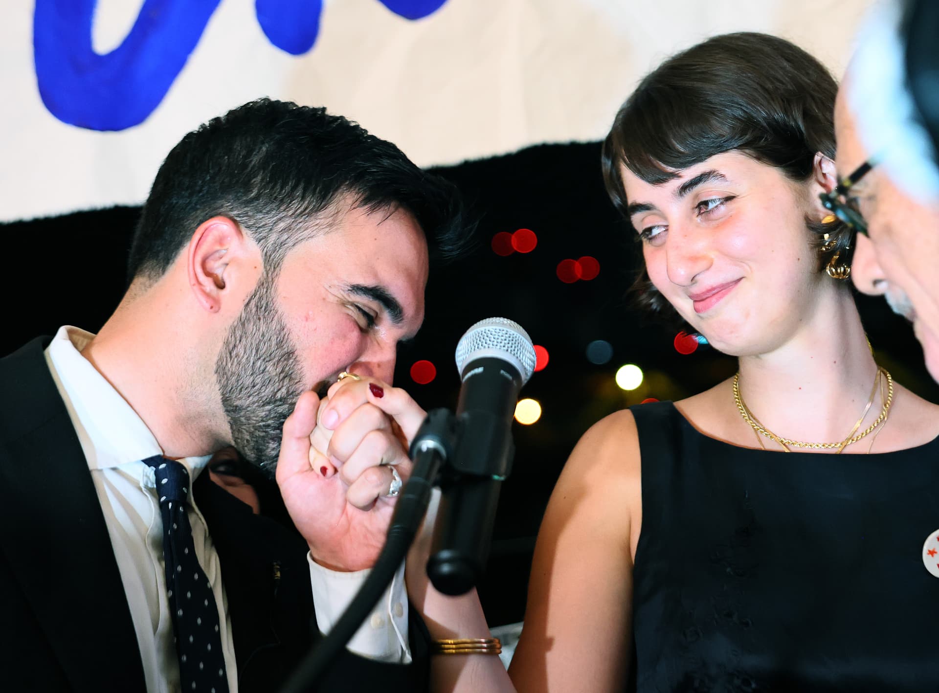 Zohran Mamdani kisses the hand of his wife Rama Duwaji as they celebrate during an election night gathering on June 24, 2025 in Queens.