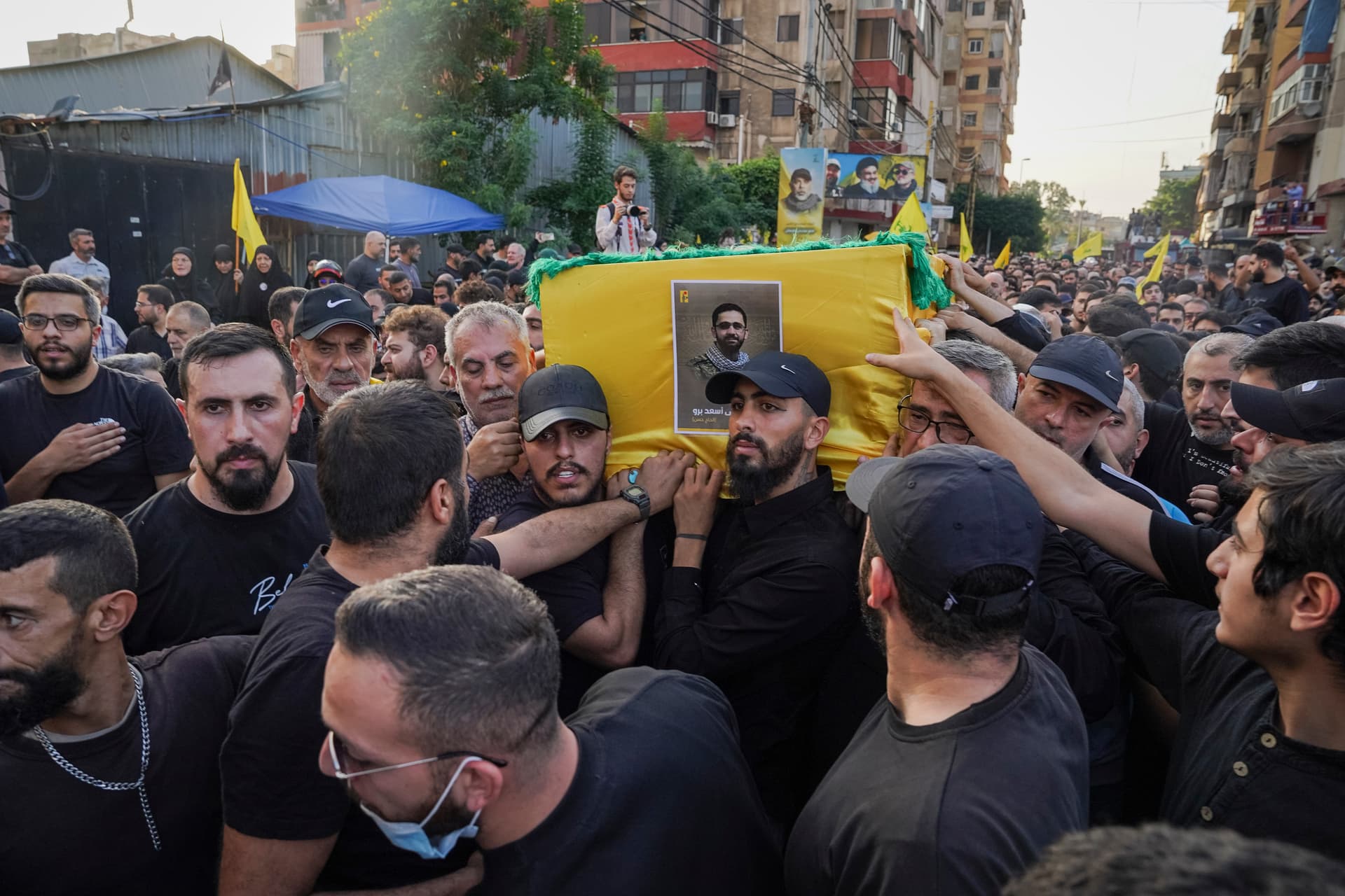 Hezbollah members carrying a coffin during a funeral procession at Beirut on November 24, 2025, for their top military commander, Haytham Ali Tabatabai, who was killed in an Israeli air strike.