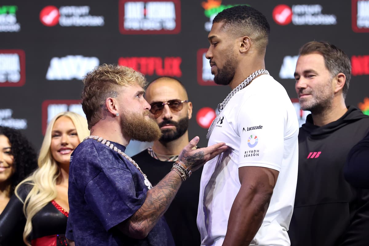 MIAMI BEACH, FLORIDA - DECEMBER 17: (L-R) Jake Paul and Anthony Joshua face off during the press conference for Jake Paul v Anthony Joshua at The Fillmore Miami Beach on December 17, 2025 in Miami Beach, Florida. (Photo by Megan Briggs/Getty Images for Netflix)