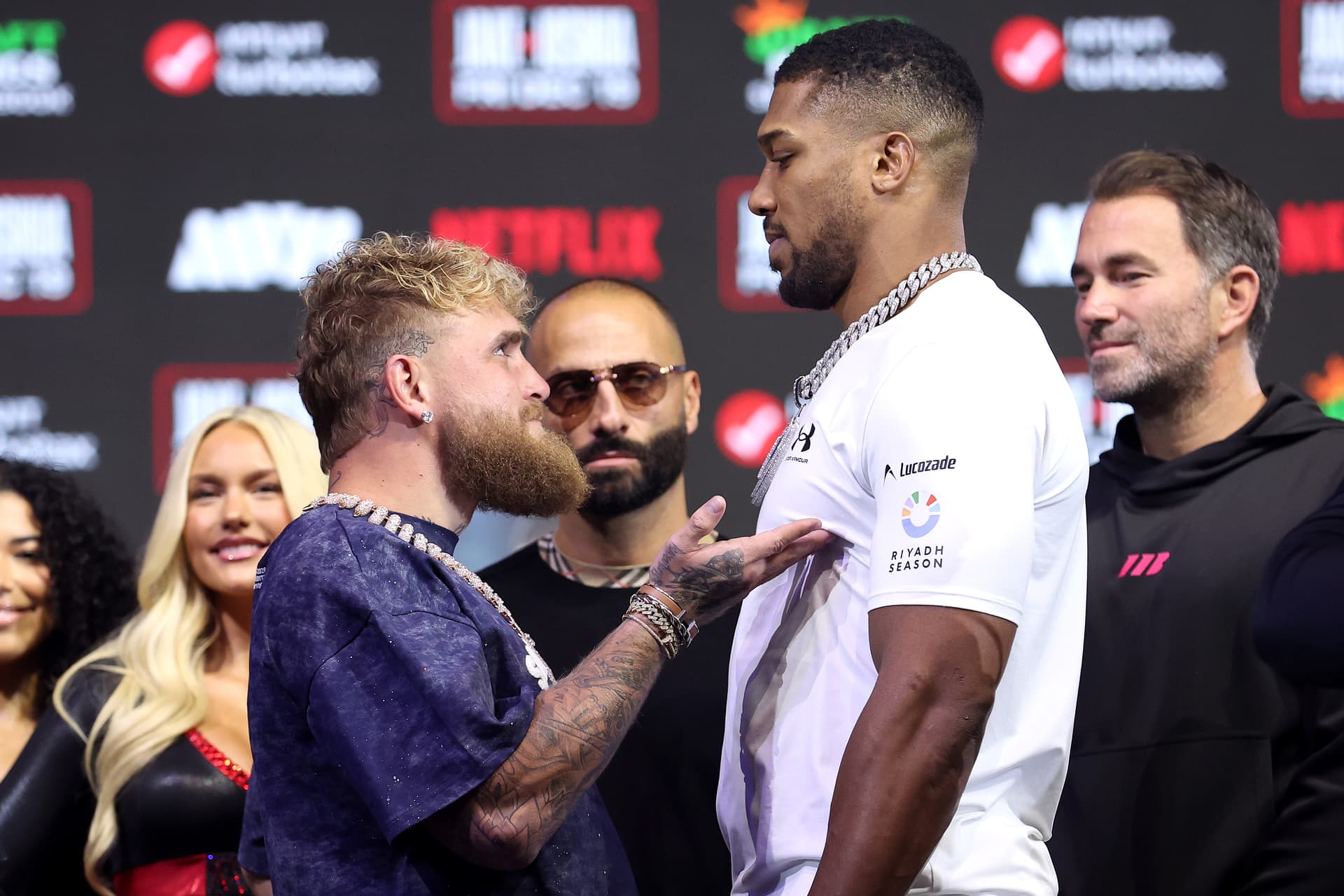 MIAMI BEACH, FLORIDA - DECEMBER 17: (L-R) Jake Paul and Anthony Joshua face off during the press conference for Jake Paul v Anthony Joshua at The Fillmore Miami Beach on December 17, 2025 in Miami Beach, Florida. (Photo by Megan Briggs/Getty Images for Netflix)