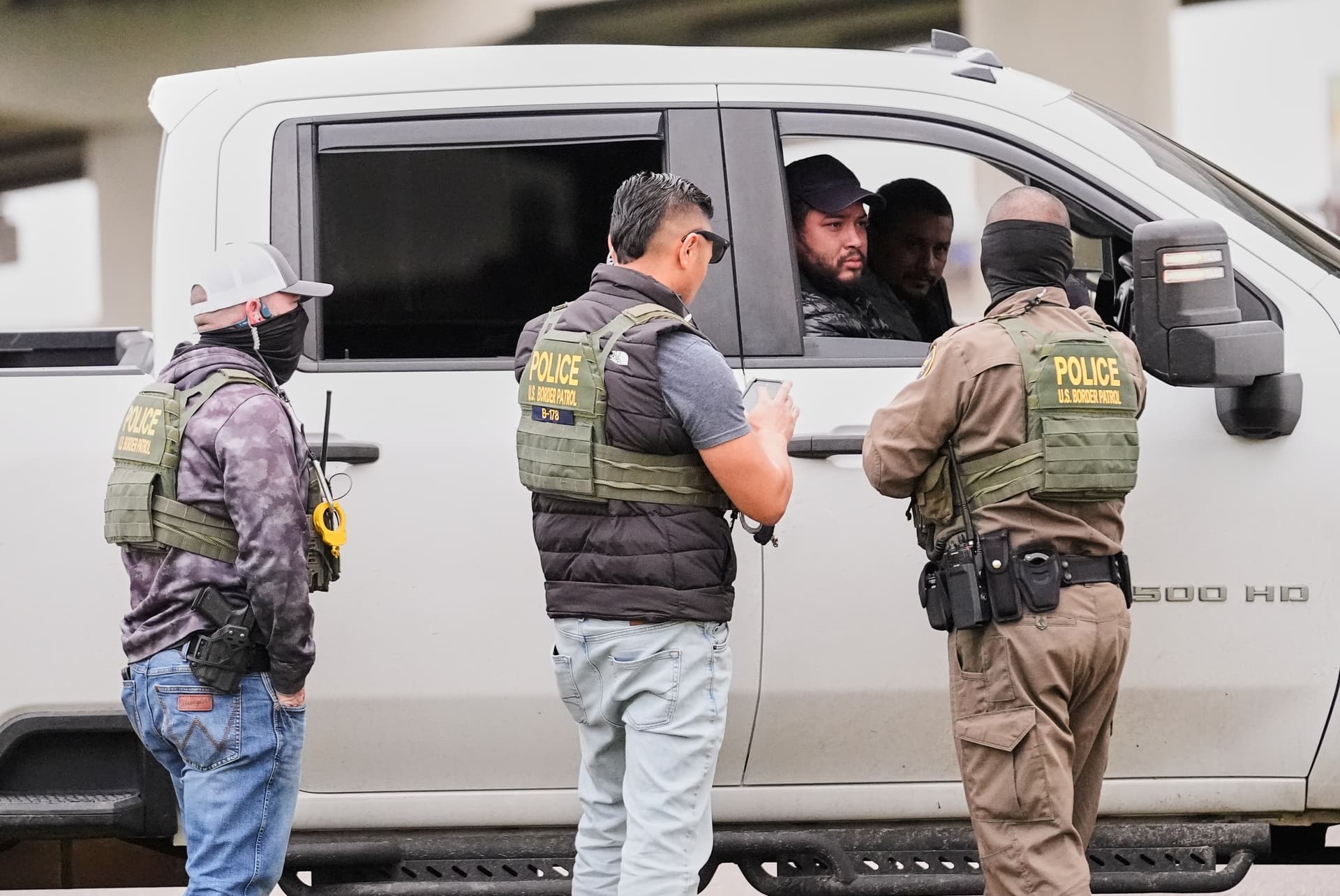 Customs and Border Patrol agents question occupants of a vehicle they pulled over, during an immigration crackdown at Kenner, Louisiana, December 5, 2025.