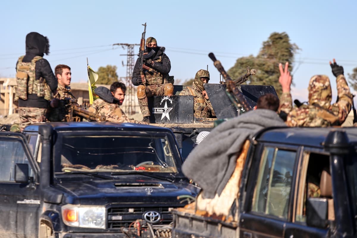 Soldiers of the Kurdish-led, U.S.-backed Syrian Democratic Forces deploy with armored military vehicles to secure roads leading to Gweiran Prison which houses men accused of being an Islamic State (ISIS) fighters at Hassakeh, northeastern Syria, Jan. 19, 2026.