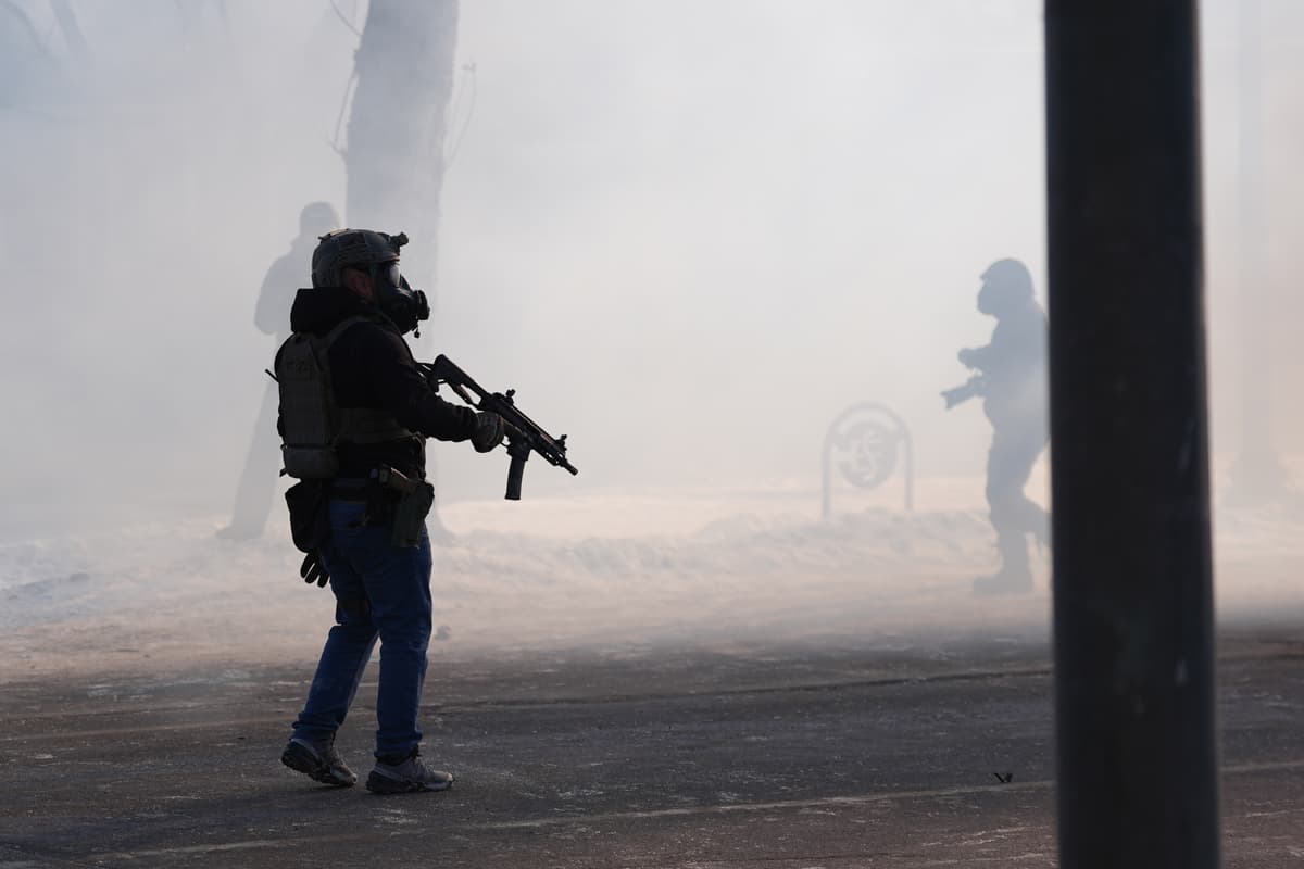 Federal immigration officers deploy tear gas after a shooting in Minneapolis on January 24, 2026.