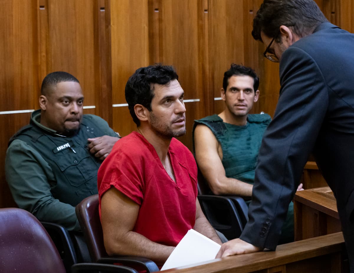 Oren Alexander, center, and his twin brother, Alon, center-right, speak to their attorney Joel Denaro during their bond hearing at Miami's Richard E. Gerstein Justice Building on December 13, 2024.