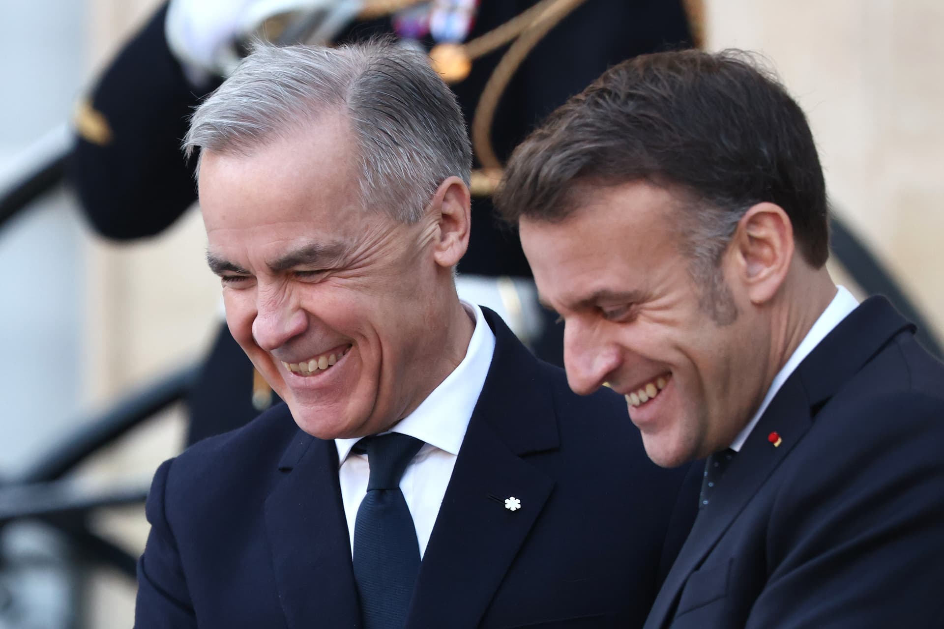 Prime Minister Mark Carney of Canada speaks with President Emmanuel Macron of France at Paris on January 6, 2026.