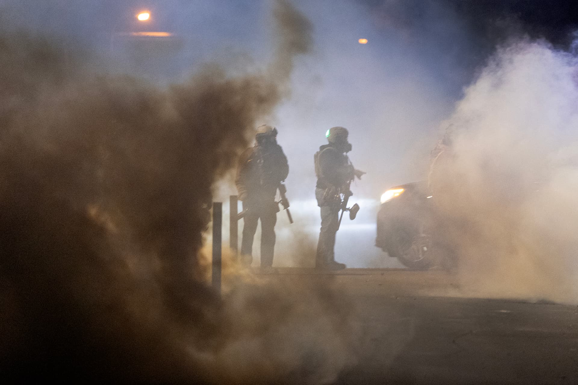Federal agents launch tear gas at residents protesting a shooting incident on January 14, 2026 at Minneapolis, Minnesota.