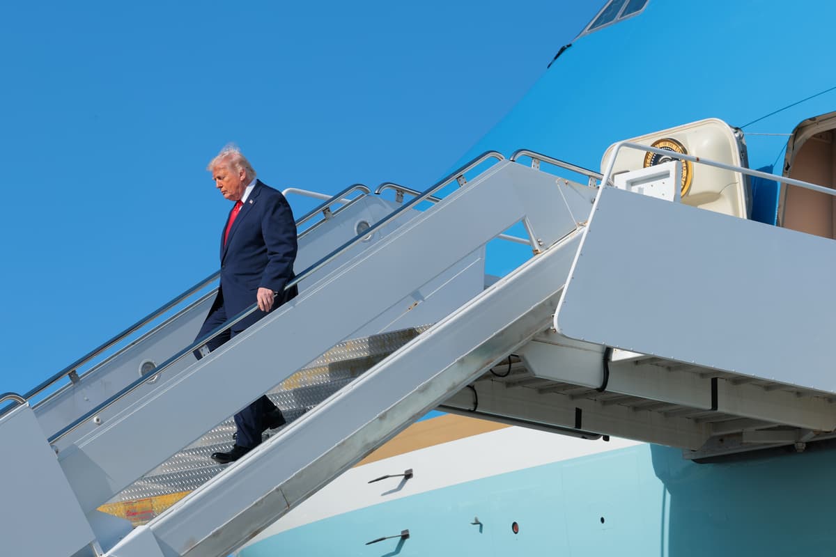 President Trump departs Air Force One after arriving at Palm Beach International Airport.