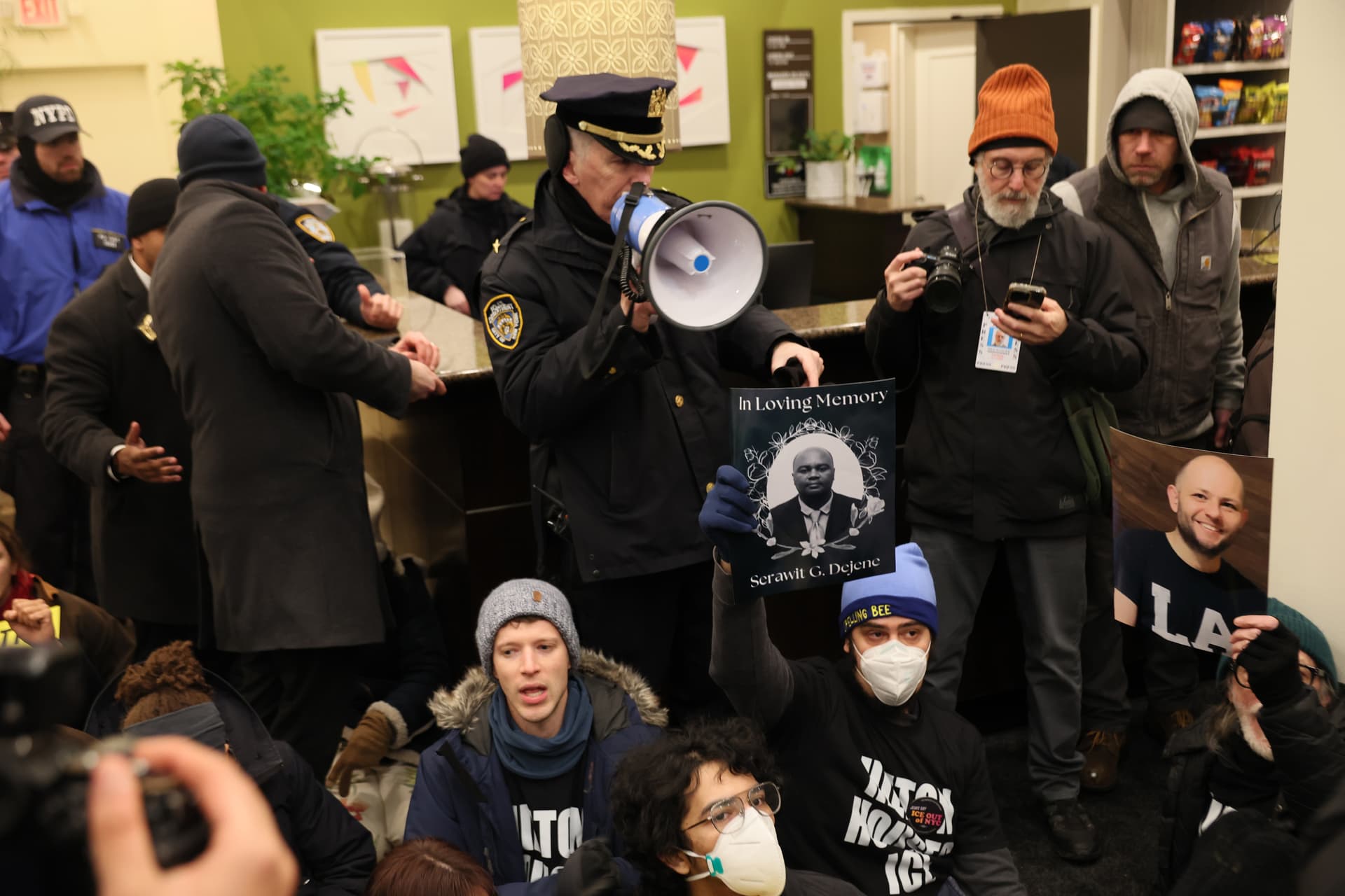 NYPD gives an order to leave or be arrested as immigration rights activists stage a sit-in at the Hilton Garden Inn on January 27, 2026. Various human rights organizations and immigration rights activists took over the lobby of the hotel where Immigration and Customs Enforcement (ICE) agents are reportedly staying.  