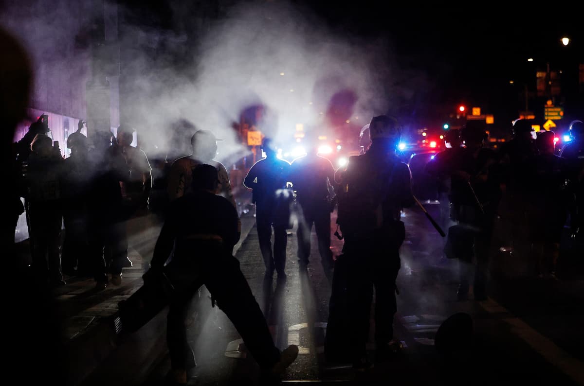 LAPD officers attempt to clear protestors during anti-ICE protests at Los Angeles on January 30, 2026. 