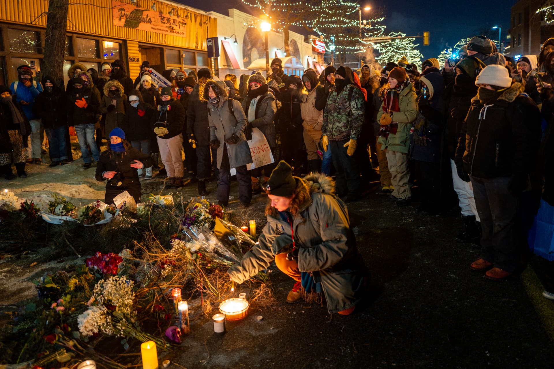 People pay their respects during a candlelight vigil for Alex Pretti after he was shot and killed earlier in the day on January 24, 2026, at Minneapolis, Minnesota. Federal agents shot and killed Pretti amid a scuffle to arrest him. The Trump administration has sent a reported 3,000 federal agents into the area, with more on the way, as they make a push to arrest undocumented immigrants in the region. 