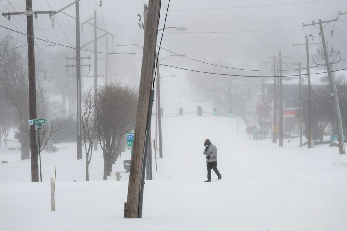A person walks in the snow at Little Rock, Arkansas, on January 24, 2026.