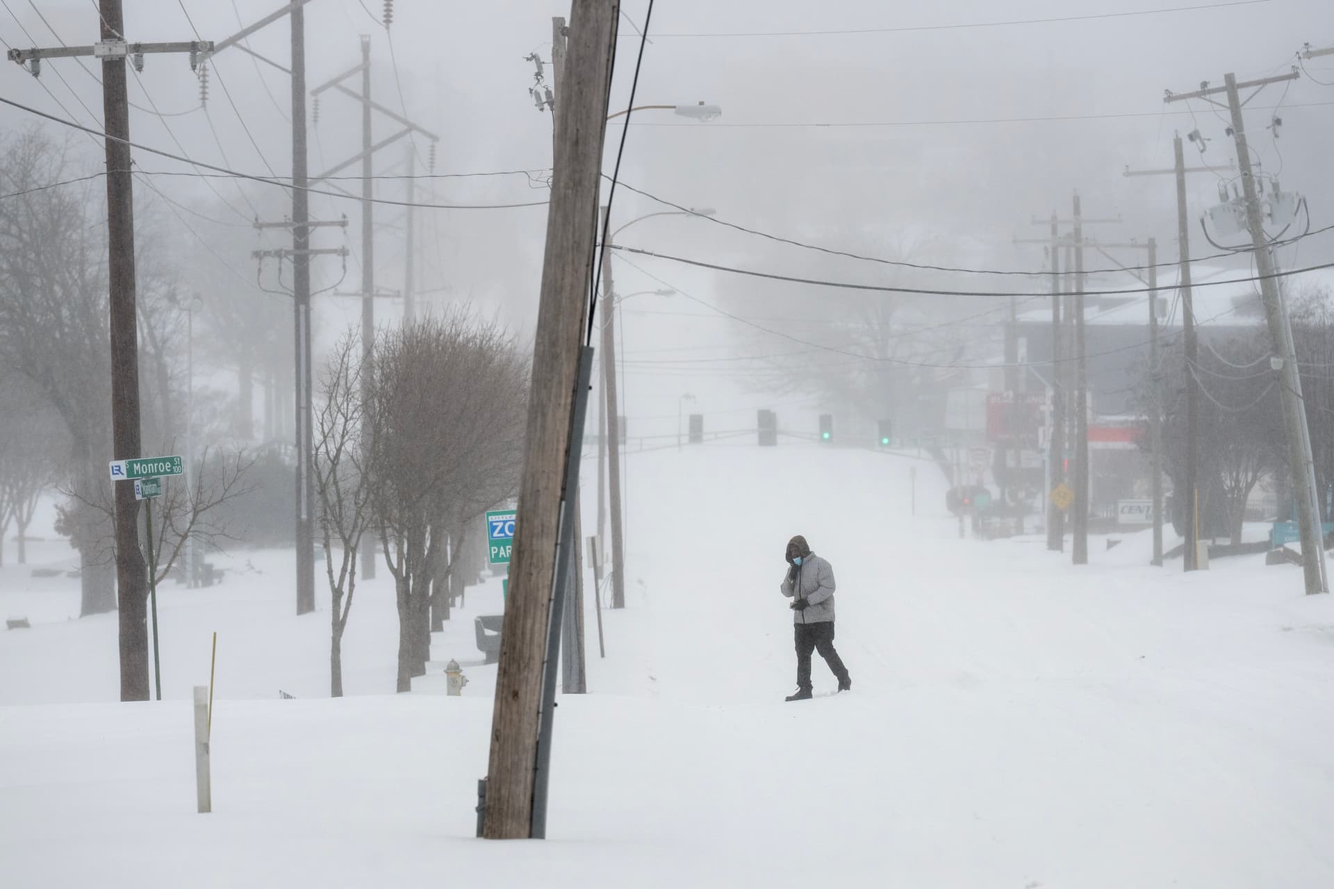 A person walks in the snow at Little Rock, Arkansas, on January 24, 2026.