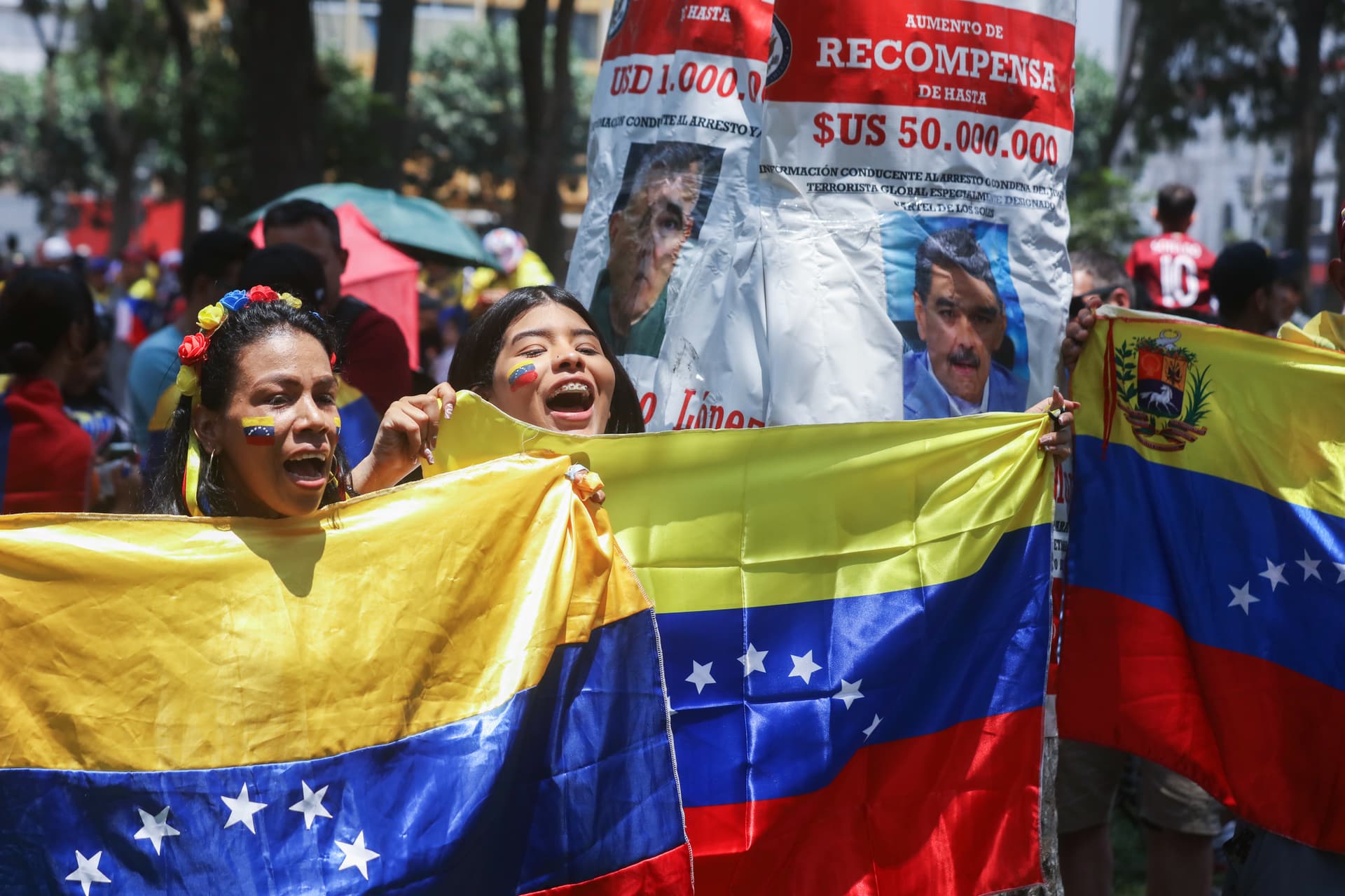 Venezuelans at Lima, Peru on January 3, 2026 celebrate the capture of Nicolas Maduro by American forces. 