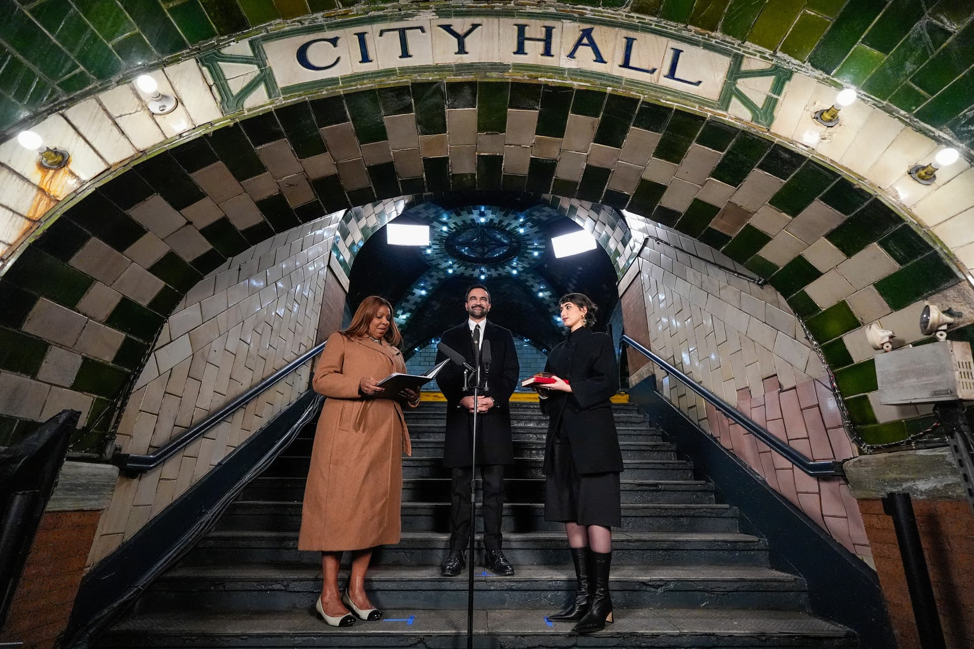 Attorney General Letitia James, left, administers the oath of office to Mayor-elect Zohran Mamdani, center, as his wife Rama Duwaji looks on, January 1, 2026.