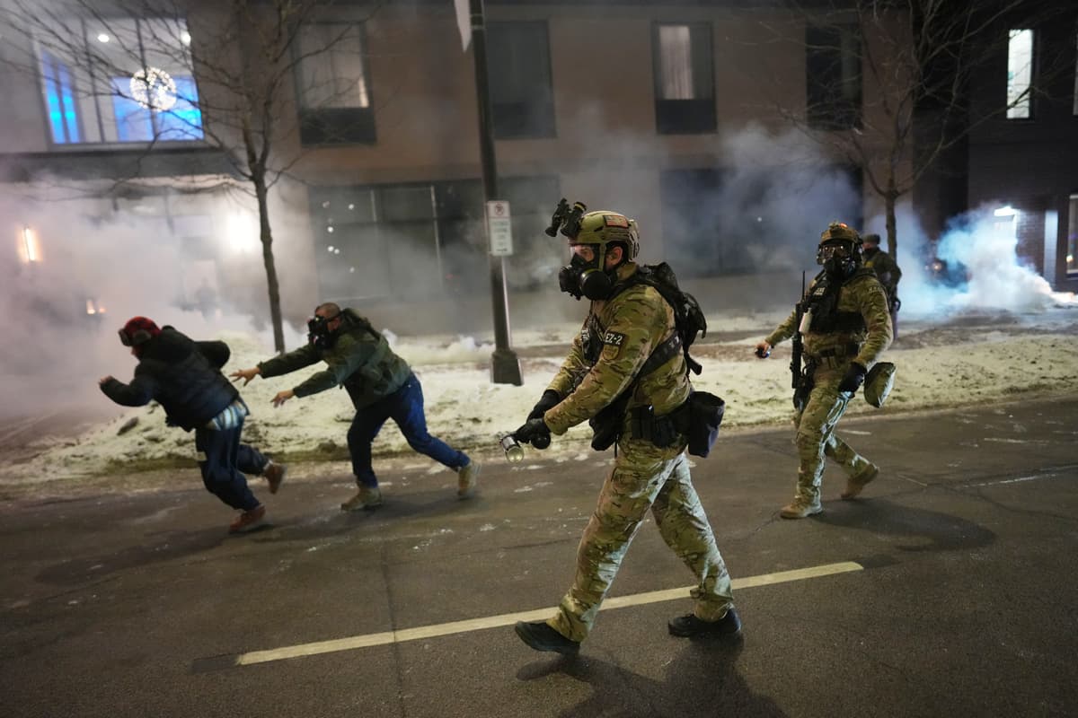 Federal agents try to clear demonstrators at Minneapolis protesting in response to federal immigration enforcement operations in the city.