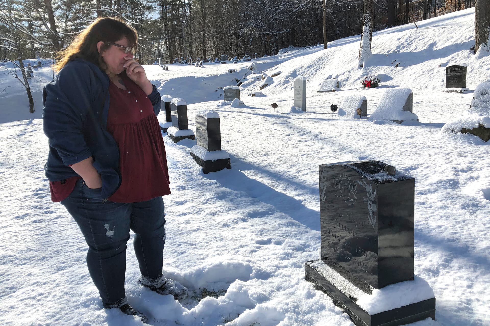 Deb Walker, of Chester, Vt., visits the grave of her daughter Brooke Goodwin, Thursday, December 9, 2021, in Chester. Goodwin, 23, died in March of 2021 of a fatal overdose of the powerful opioid fentanyl and xylazine, an animal tranquilizer that is making its way into the illicit drug supply, particularly in the Northeast. 