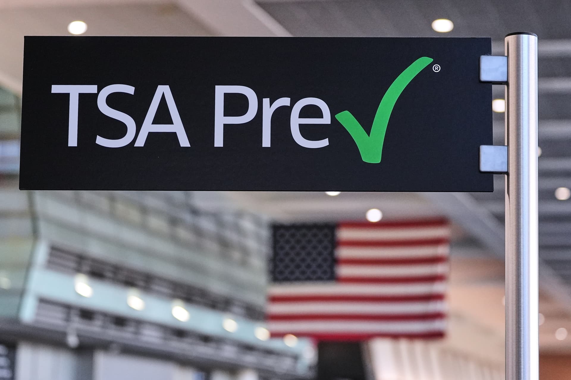 A TSA PreCheck sign is posted at a security line in Terminal A at Logan Airport, Dec. 9, 2025, at Boston.