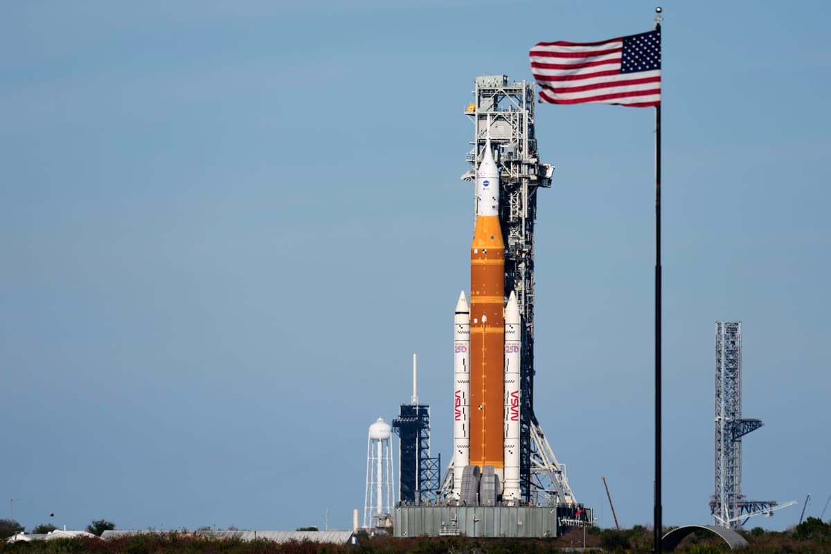NASA's Artemis II moon rocket with the Orion spacecraft rolls back toward the vehicle assembly building at the Kennedy Space Center at Cape Canaveral, Florida, on February 25, 2026.
