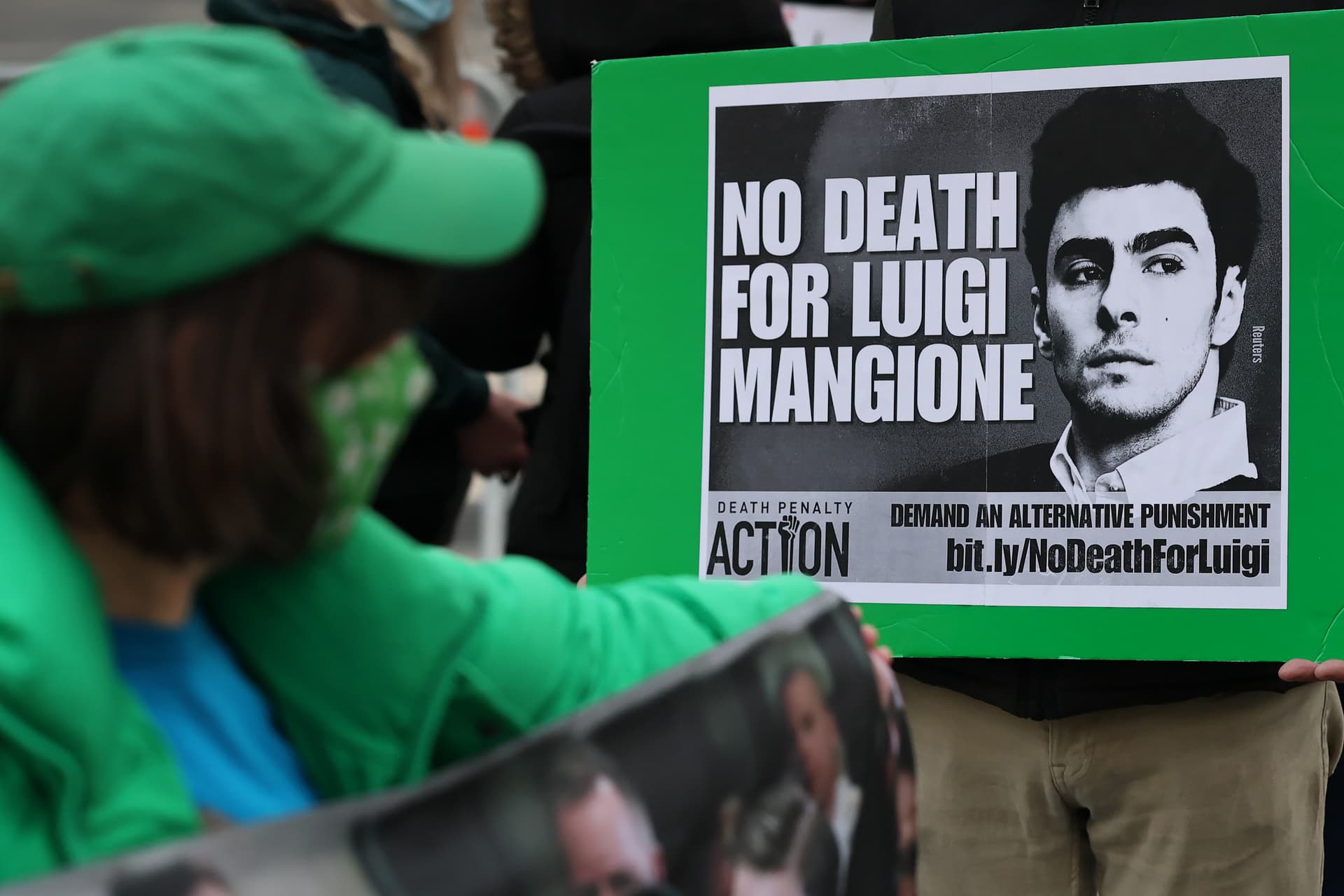 Supporters of Luigi Mangione wait in line to enter Manhattan Federal Court on January 09, 2026. 