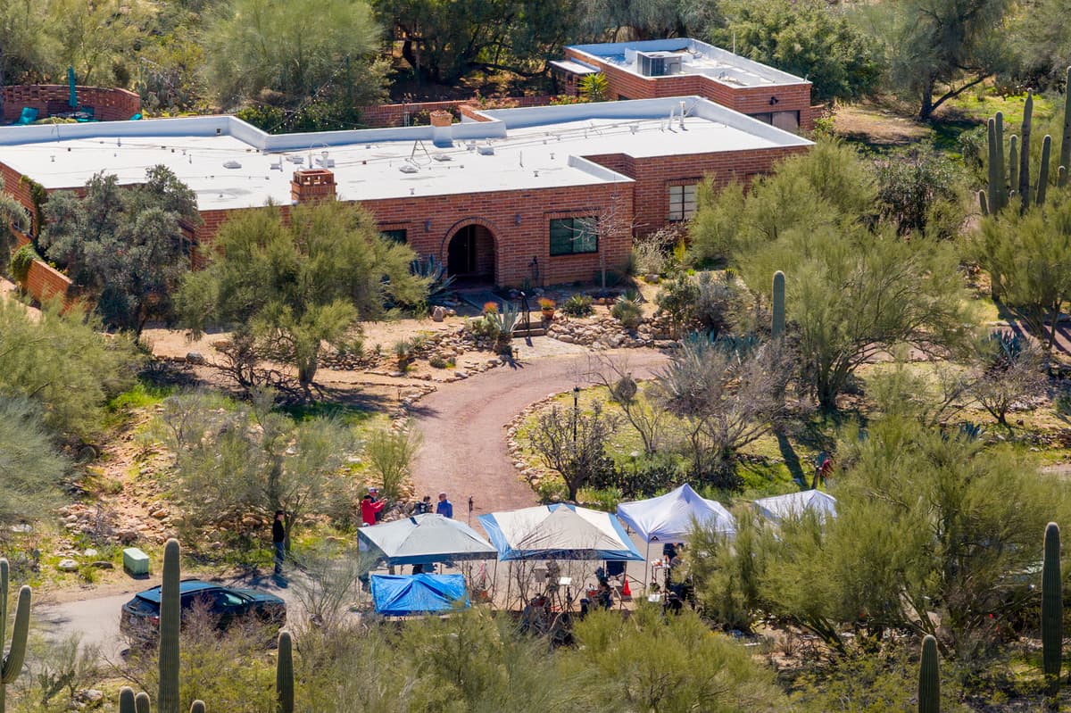 In an aerial view, news broadcasters are stationed outside Nancy Guthrie's residence on February 18, 2026 in Tucson, Arizona.  