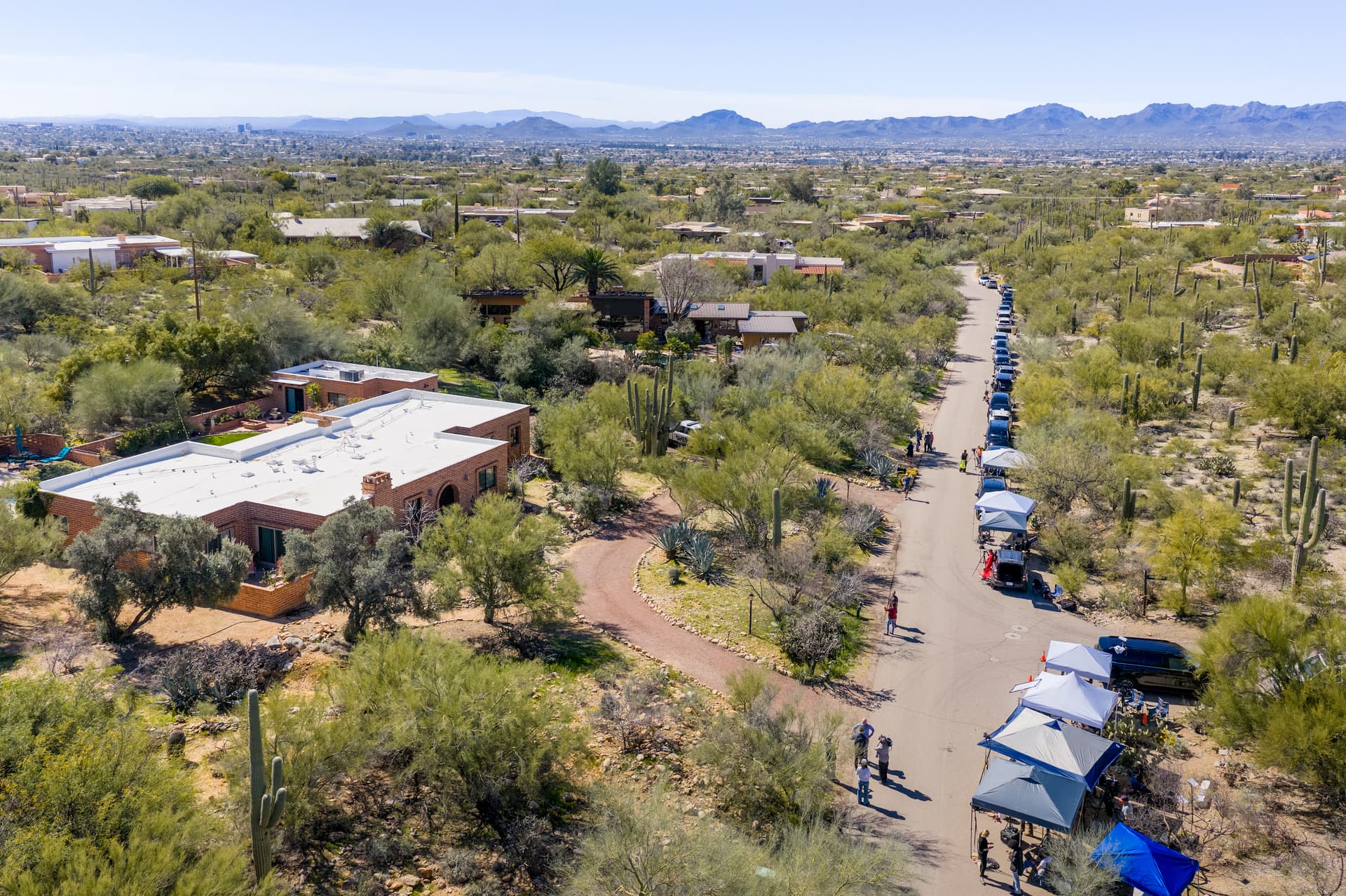 In an aerial view, news broadcasters are stationed outside Nancy Guthrie's residence on February 18, 2026 in Tucson, Arizona.  