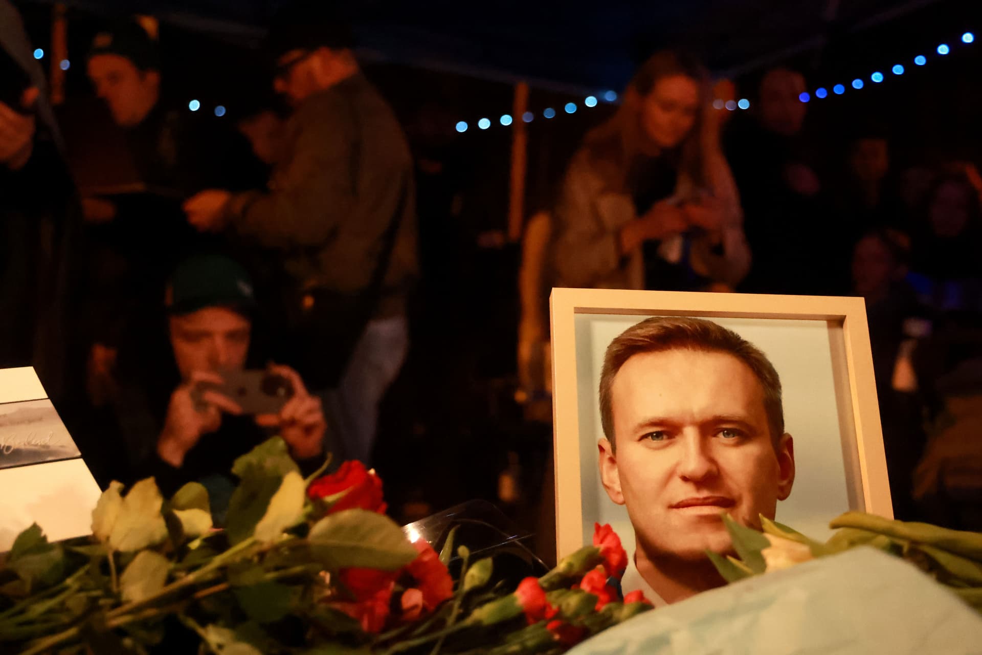 Supporters leave flowers during a vigil for Alexei Navalny in front of the Russian consulate general at Munich, Germany, hours after his death on February 16, 2024.