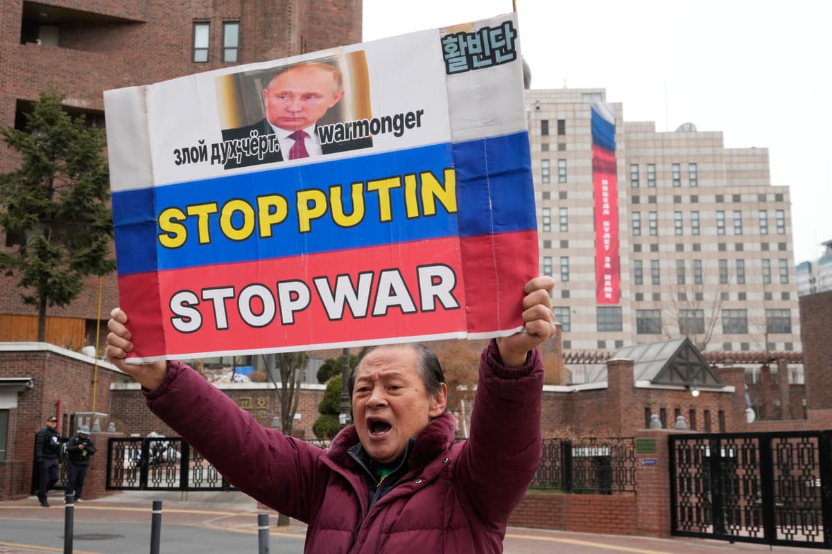 A South Korean protester holds a banner to denounce Russia's invasion of Ukraine  at Seoul, South Korea, on February 24, 2026. 