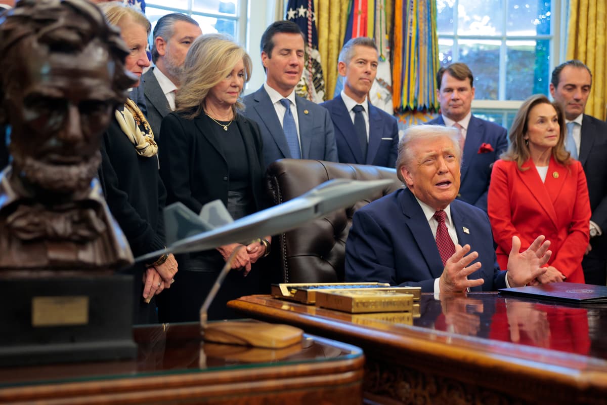 President Donald Trump, joined by executives from major automobile makers, announces an easing of the country's fuel economy standards at the White House on December 3, 2025.